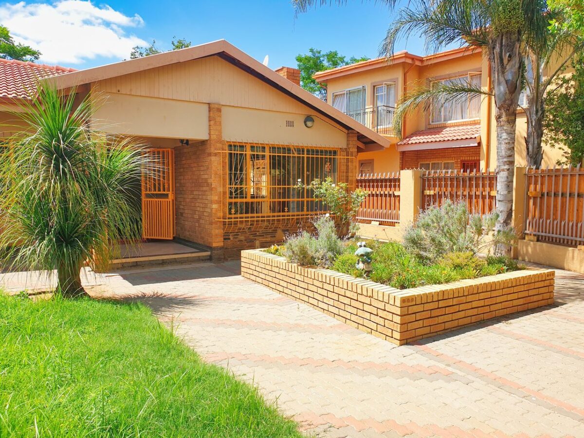 Promotion Rue 66 Beautiful suburban home in Pretoria, featuring lush greenery and modern architecture.